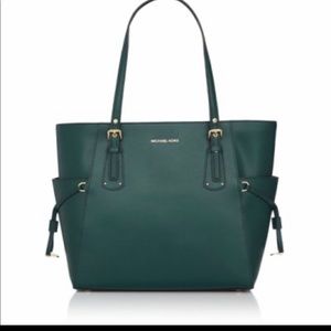 Michael Kors Voyager bag in forest green.